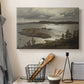 Canvas art print detailing a serene Nordic landscape with fjord and natural light, displayed in a softly lit workspace setting