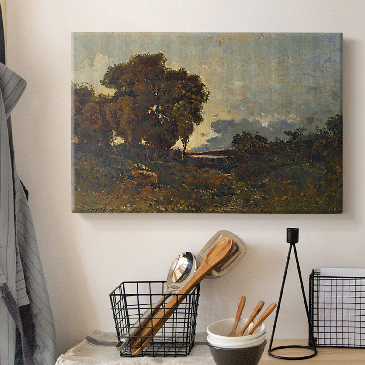 Canvas art print detailing an atmospheric landscape with soft light fading across horizon, displayed in a softly lit workspace setting