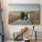 Canvas art print detailing a peaceful rural setting with elderly man and child, displayed in a softly lit workspace setting