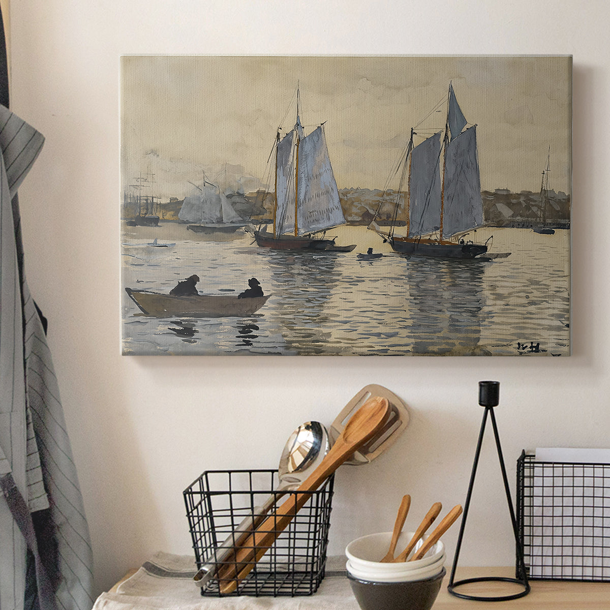 Canvas art print detailing a coastal view featuring two schooners under clear sky, displayed in a softly lit workspace setting