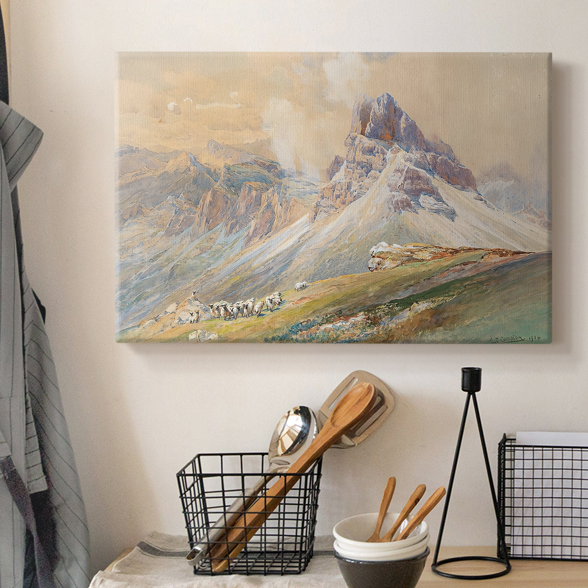 Canvas art print detailing a realistic mountain view with strong geological forms, displayed in a softly lit workspace setting