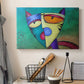 Canvas art print detailing a stylized cat with symmetry, displayed in a softly lit workspace setting