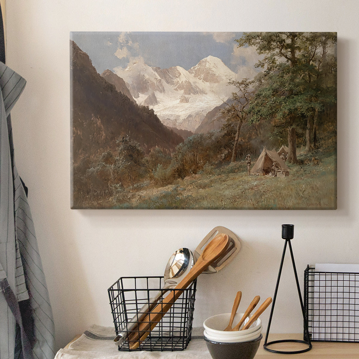 Canvas art print detailing a realistic depiction of remote mountain environment, displayed in a softly lit workspace setting