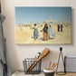 Canvas art print detailing a cultural landscape with desert foreground and historic structures, displayed in a softly lit workspace setting