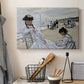 Canvas art print detailing a coastal leisure scene with figures looking out to sea, displayed in a softly lit workspace setting