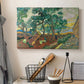 Canvas art print detailing a stylized garden composition with movement, displayed in a softly lit workspace setting