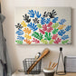 Canvas art print detailing a stylized collage resembling leaves, displayed in a softly lit workspace setting