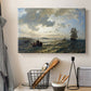 Canvas art print detailing an atmospheric coastal view with motion in sky and sea, displayed in a softly lit workspace setting