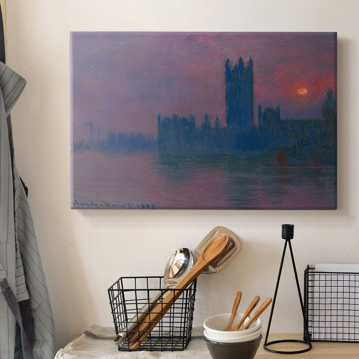 Canvas art print detailing a dramatic skyline with reflections under colorful sky, displayed in a softly lit workspace setting