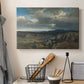 Canvas art print detailing a dramatic landscape with elevation and open sky, displayed in a softly lit workspace setting