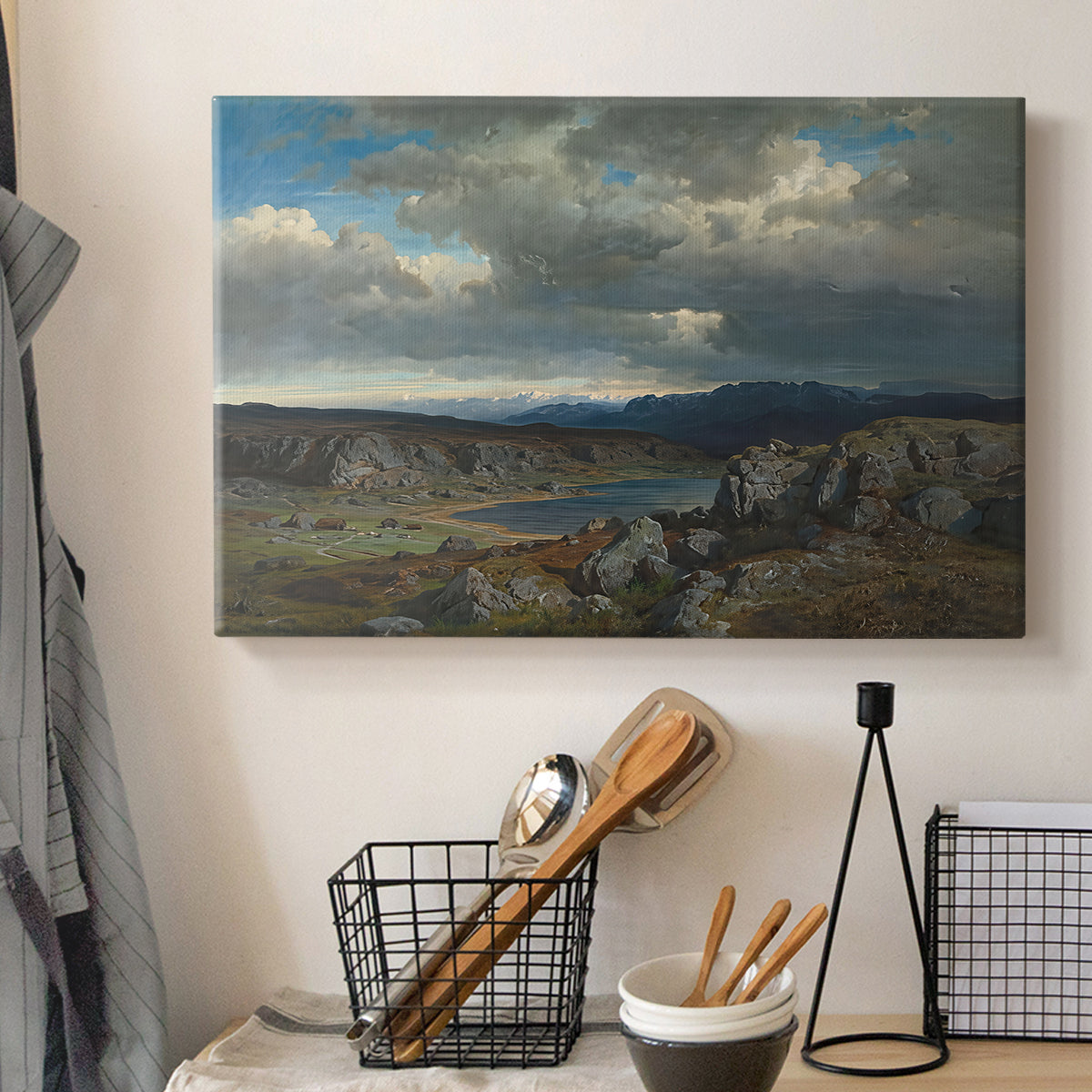 Canvas art print detailing a dramatic landscape with elevation and open sky, displayed in a softly lit workspace setting