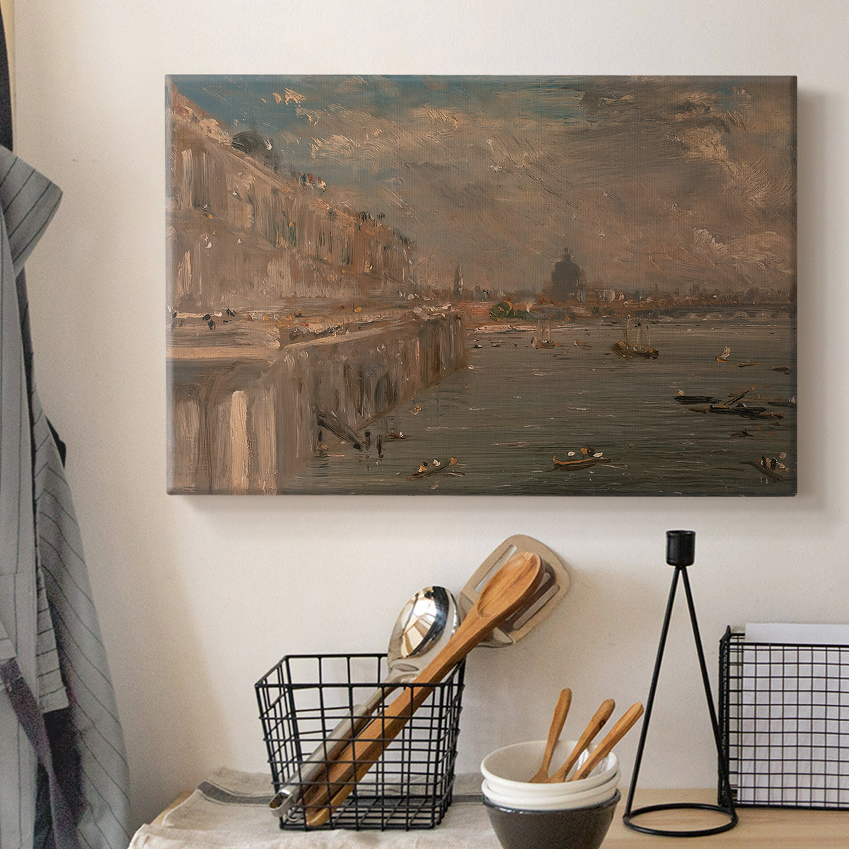 Canvas art print detailing a composition featuring bridge and buildings, displayed in a softly lit workspace setting