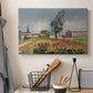 Canvas art print detailing a tranquil outdoor view centered on a bridge in nature, displayed in a softly lit workspace setting