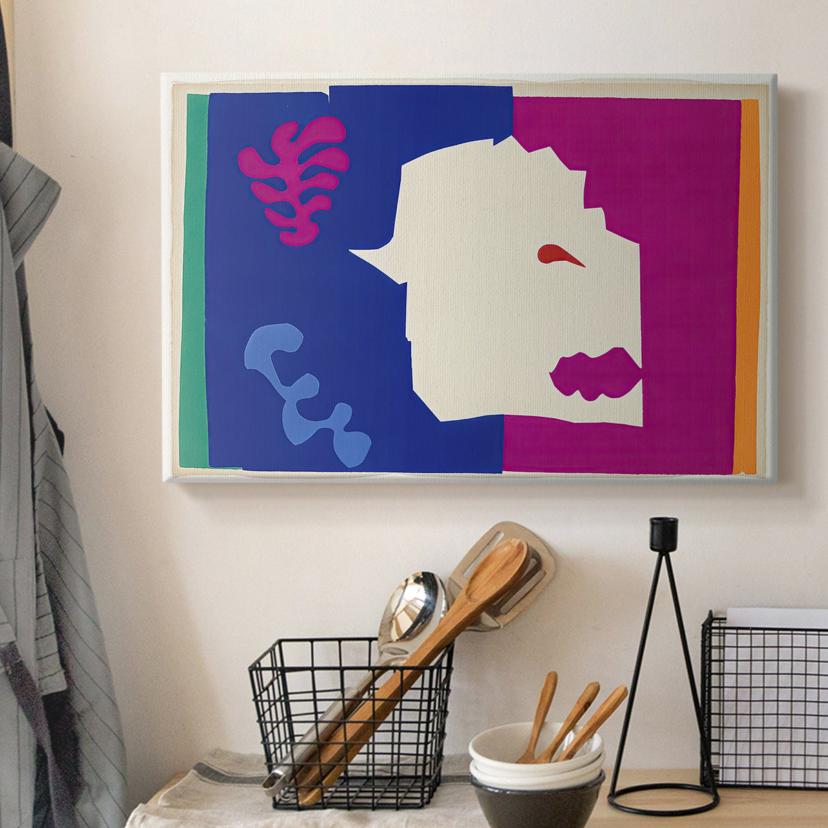 Canvas art print detailing a symbolic cut-out animal design, displayed in a softly lit workspace setting