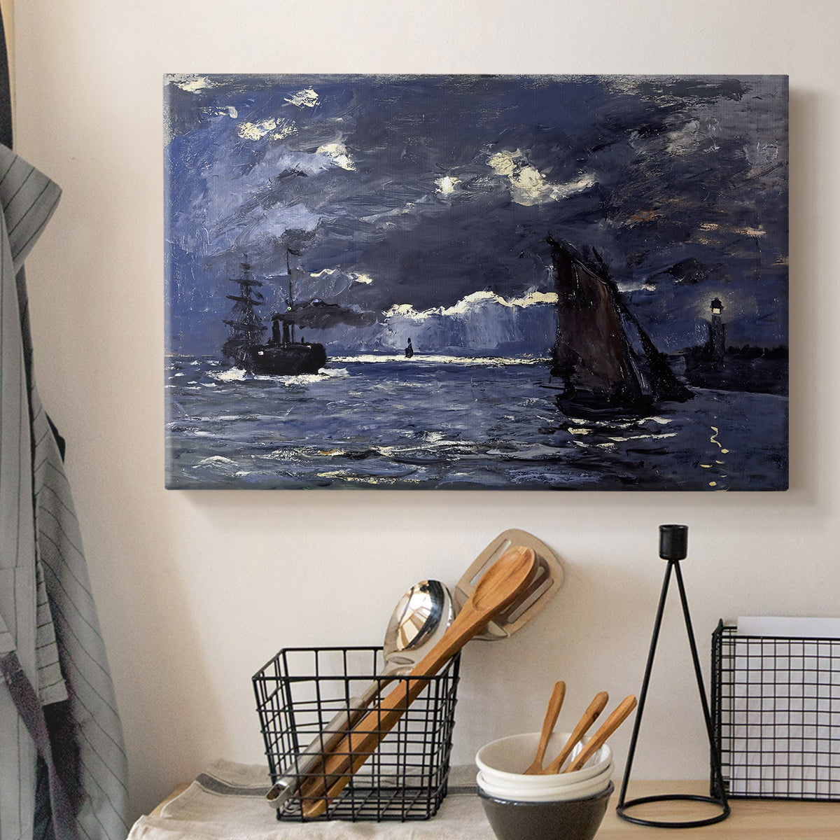 Canvas art print detailing an atmospheric maritime view with ships in moonlit darkness, displayed in a softly lit workspace setting
