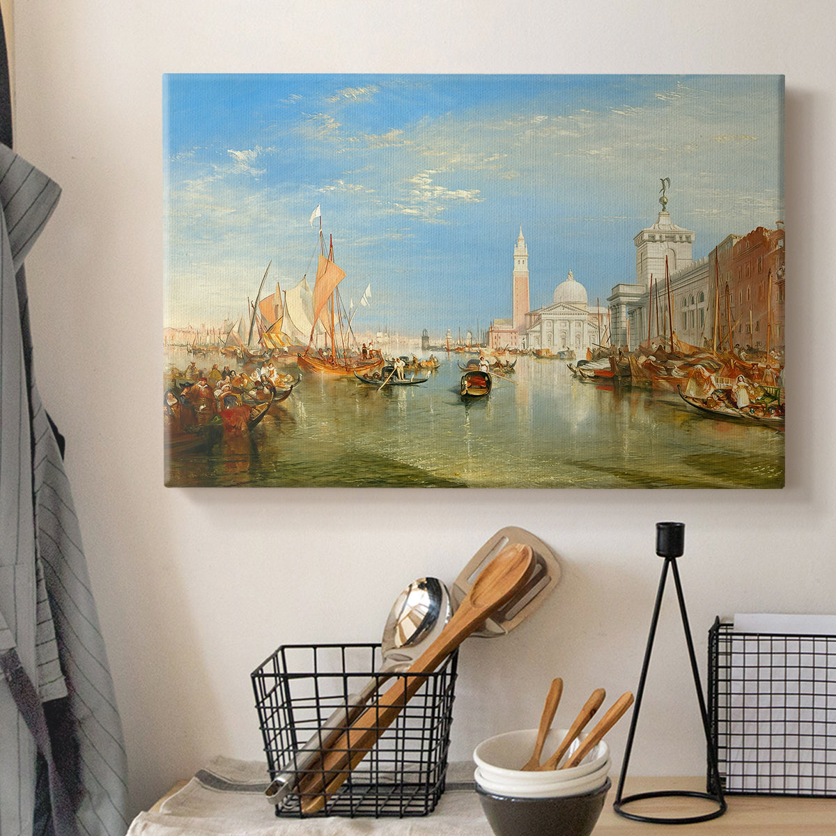 Canvas art print detailing a coastal urban composition, displayed in a softly lit workspace setting