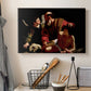 Canvas art print detailing an intense religious narrative with figures in close physical struggle, displayed in a softly lit workspace setting