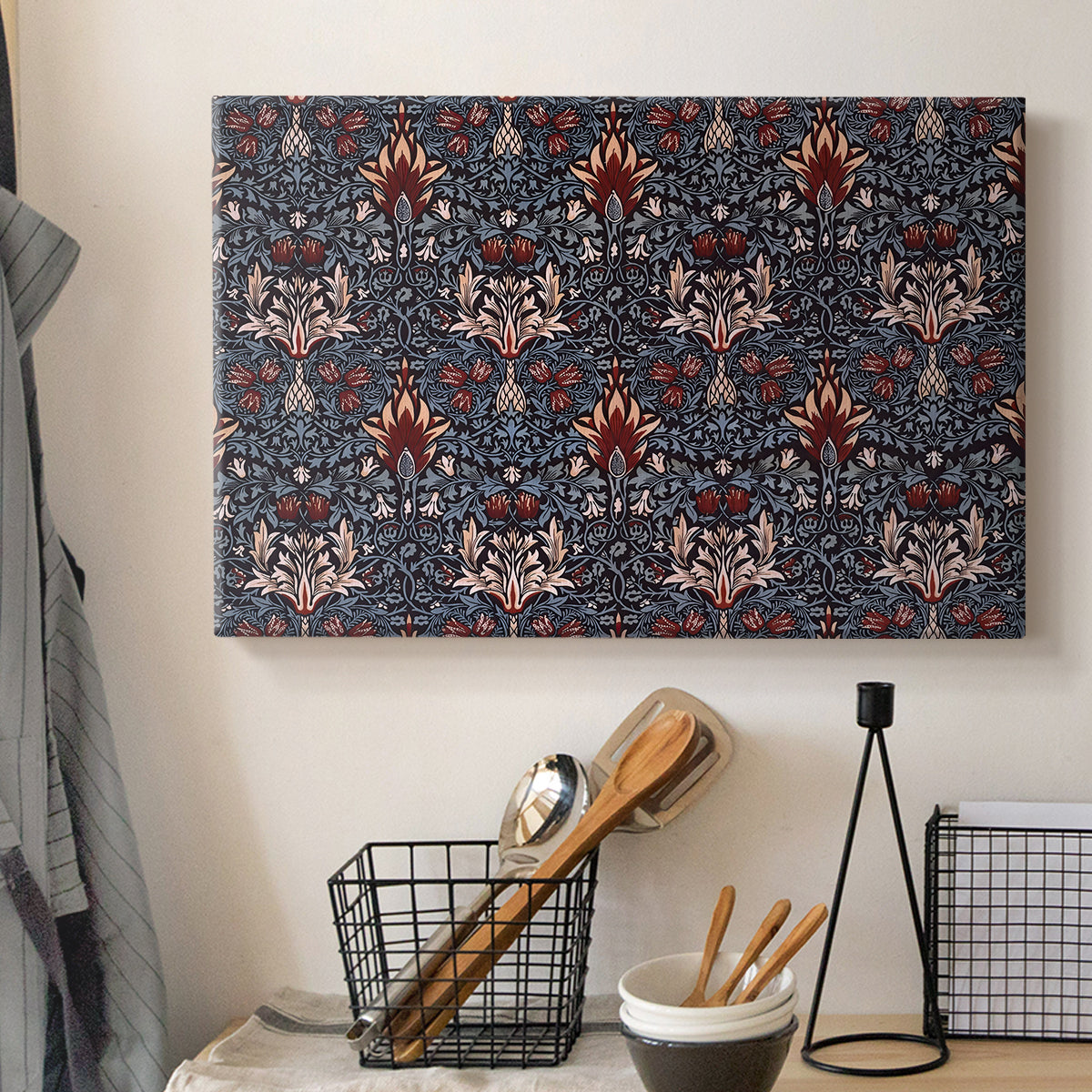 Canvas art print detailing a structured botanical motif with repeating curved shapes, displayed in a softly lit workspace setting