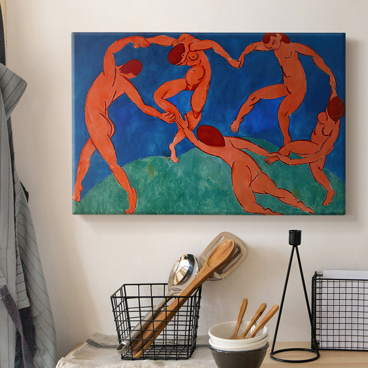 Canvas art print detailing a stylized dance scene with strong color contrast, displayed in a softly lit workspace setting