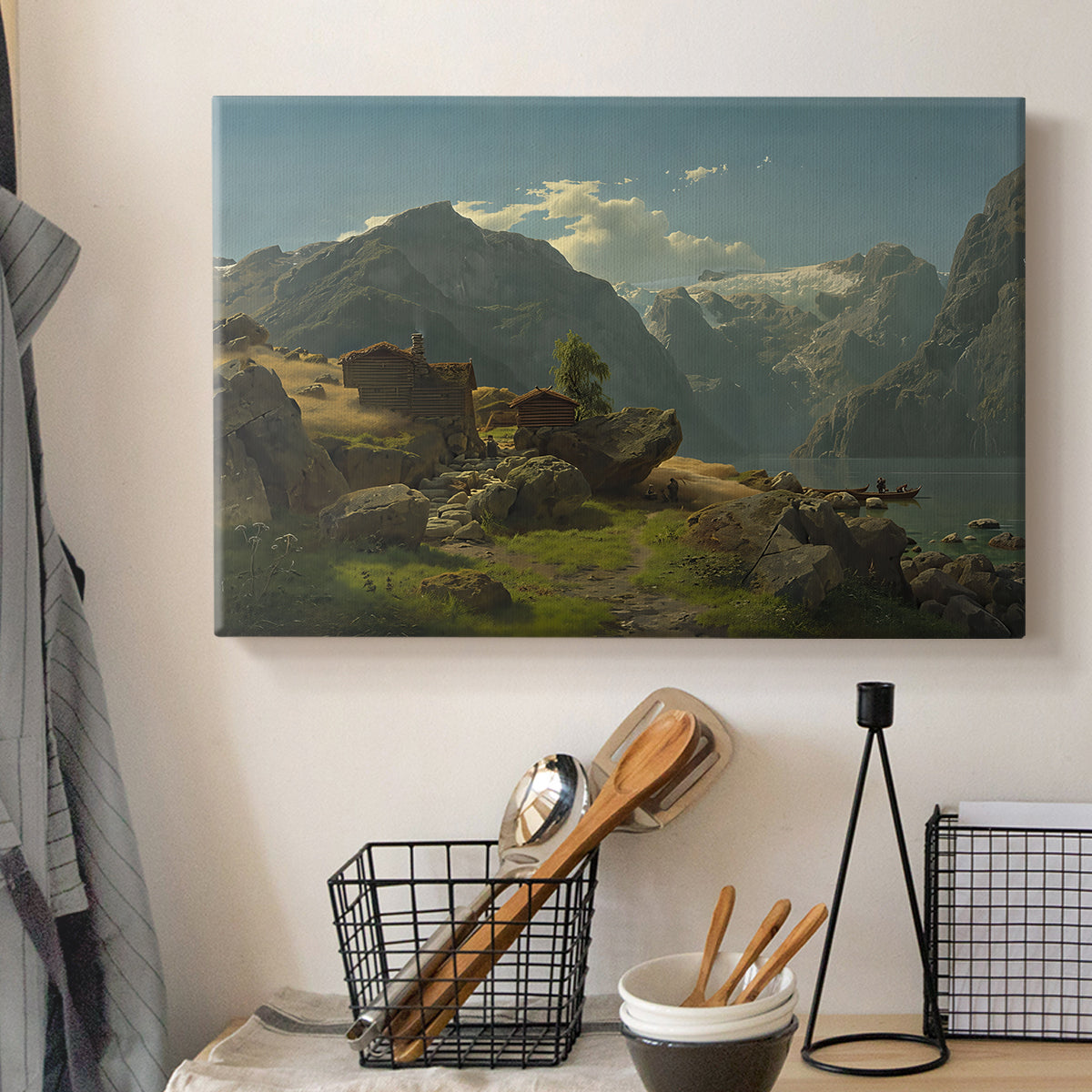 Canvas art print detailing an expansive Nordic view with shoreline and distant mountains, displayed in a softly lit workspace setting