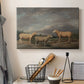 Canvas art print detailing a realistic depiction of sheep in countryside, displayed in a softly lit workspace setting