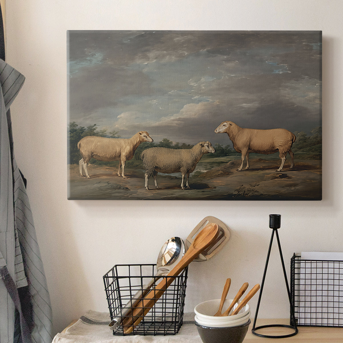 Canvas art print detailing a realistic depiction of sheep in countryside, displayed in a softly lit workspace setting