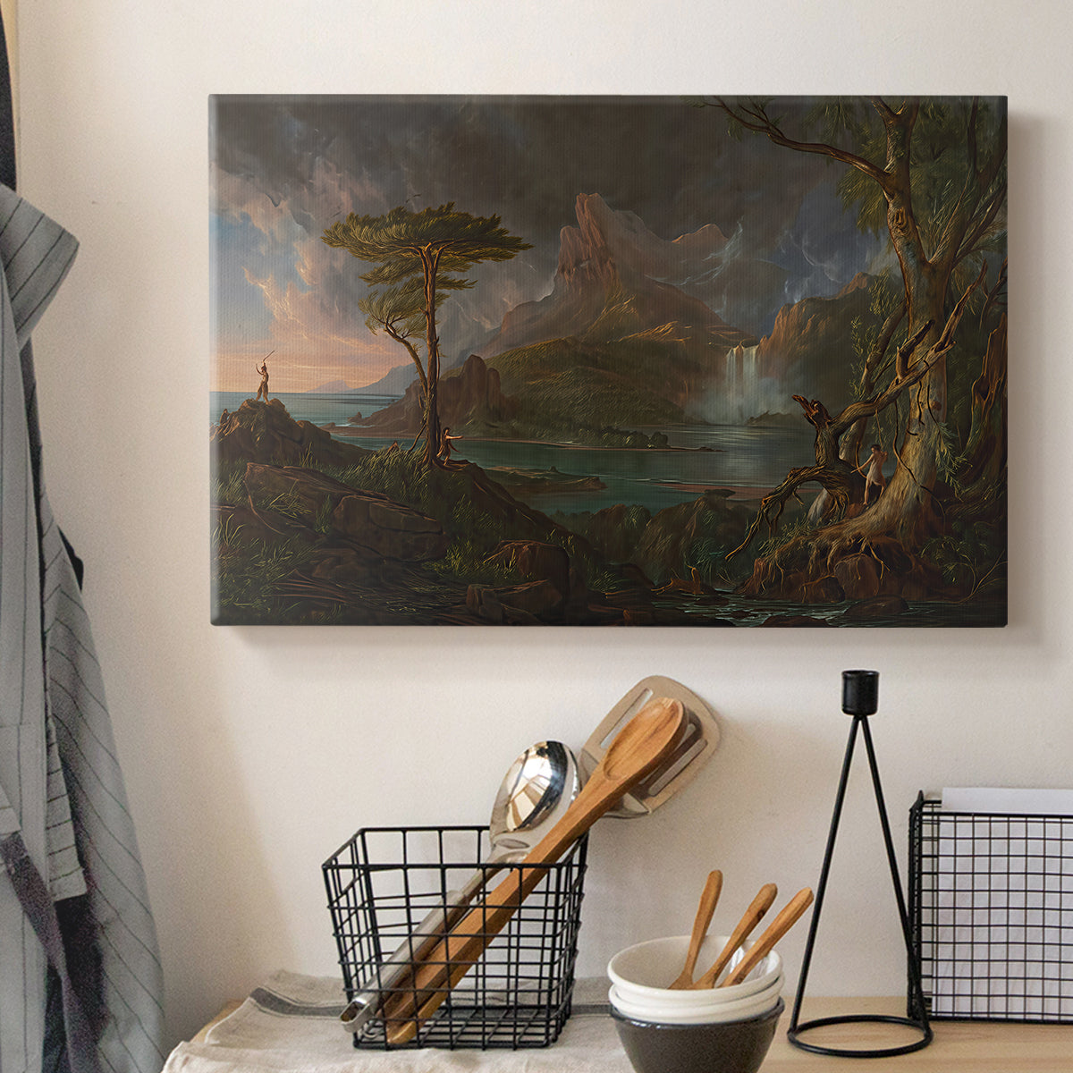 Canvas art print detailing a romantic depiction of wild terrain, displayed in a softly lit workspace setting