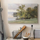 Canvas art print detailing a tranquil lakeside view with soft atmospheric tones, displayed in a softly lit workspace setting