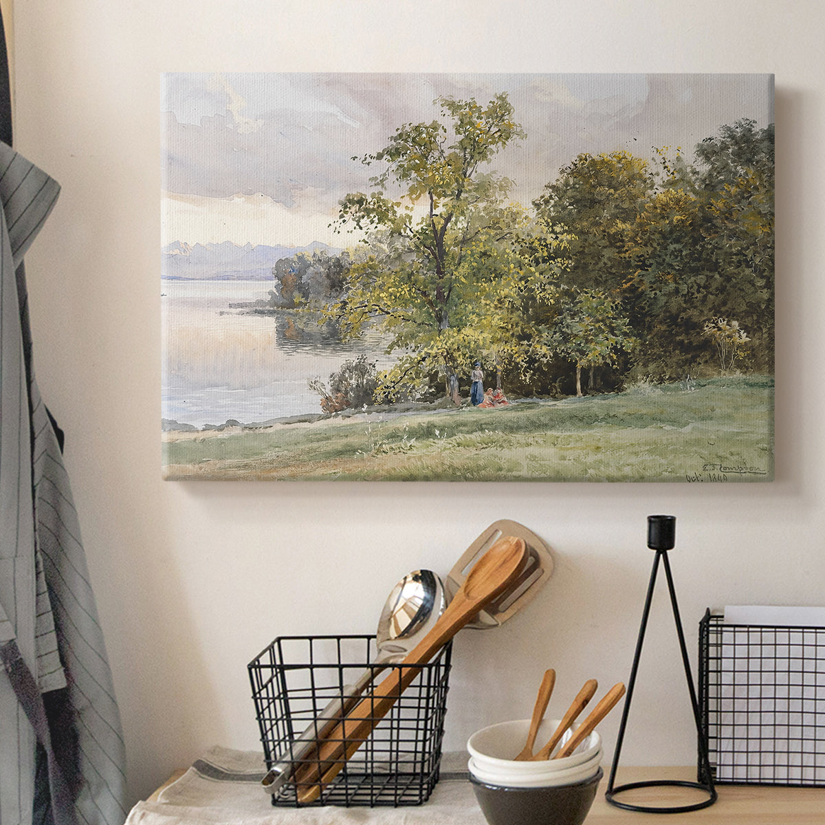 Canvas art print detailing a tranquil lakeside view with soft atmospheric tones, displayed in a softly lit workspace setting