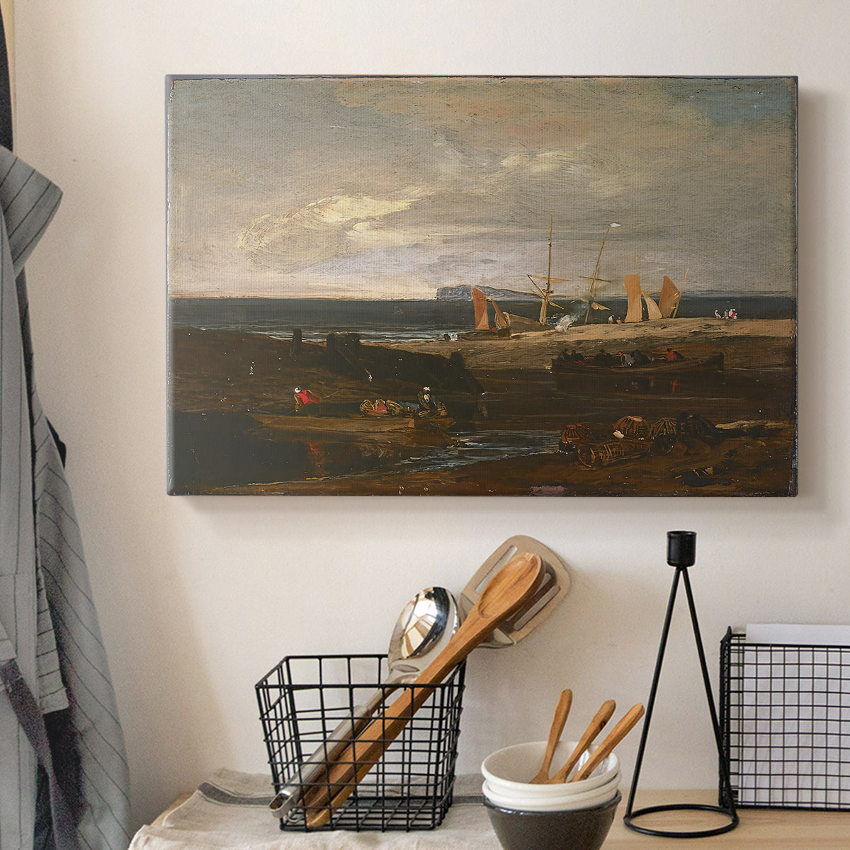 Canvas art print detailing an expressive coastal landscape, displayed in a softly lit workspace setting