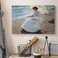 Canvas art print detailing a serene beach scene with single figure and soft light, displayed in a softly lit workspace setting