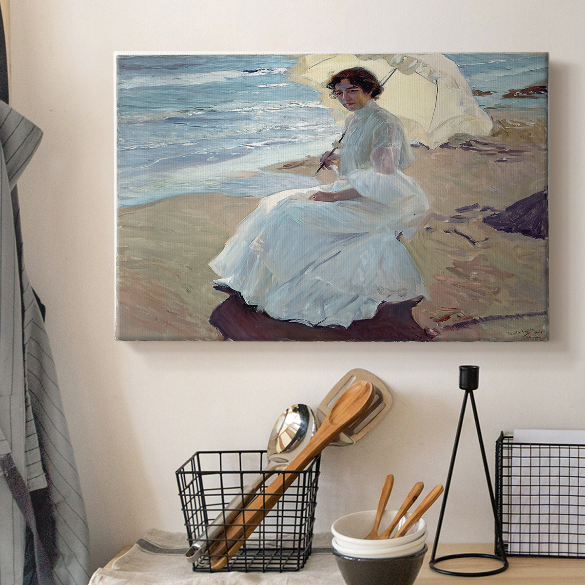 Canvas art print detailing a serene beach scene with single figure and soft light, displayed in a softly lit workspace setting