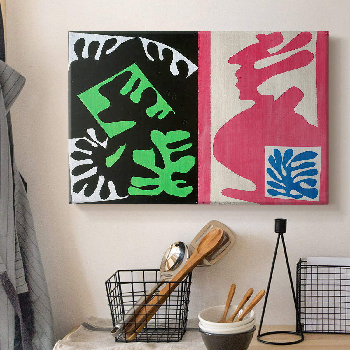 Canvas art print detailing an expressive collage with overlapping shapes and patterns, displayed in a softly lit workspace setting