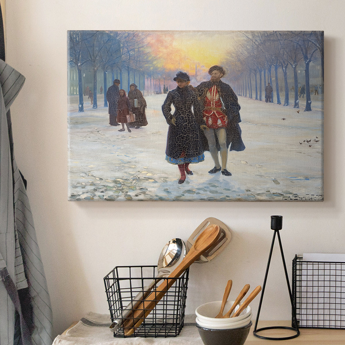 Canvas art print detailing a rural winter landscape with people walking together, displayed in a softly lit workspace setting