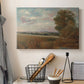 Canvas art print detailing an atmospheric landscape with depth, displayed in a softly lit workspace setting