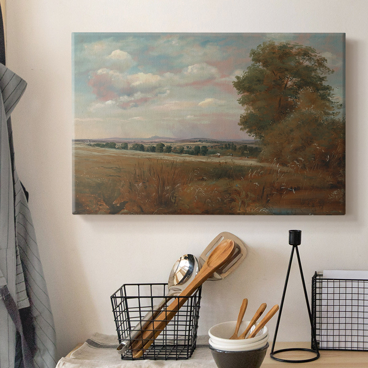 Canvas art print detailing an atmospheric landscape with depth, displayed in a softly lit workspace setting