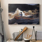 Canvas art print detailing a dynamic water scene with figures steering boat through rapids, displayed in a softly lit workspace setting