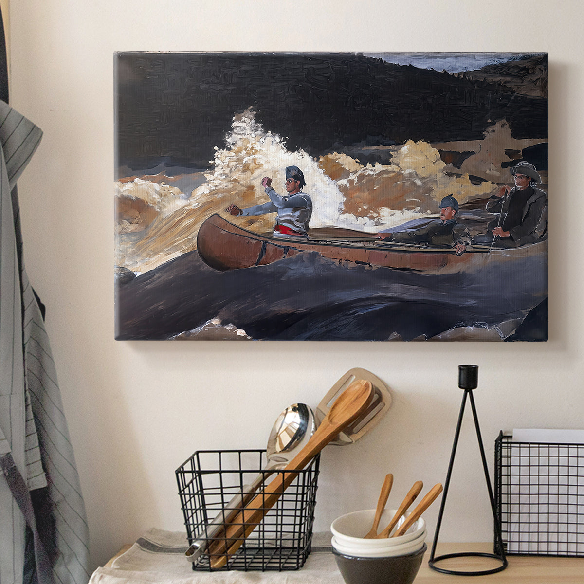 Canvas art print detailing a dynamic water scene with figures steering boat through rapids, displayed in a softly lit workspace setting