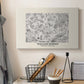 Canvas art print detailing a textile-style floral composition with repeating motifs, displayed in a softly lit workspace setting