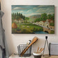 Canvas art print detailing a peaceful landscape combining human activity and nature, displayed in a softly lit workspace setting
