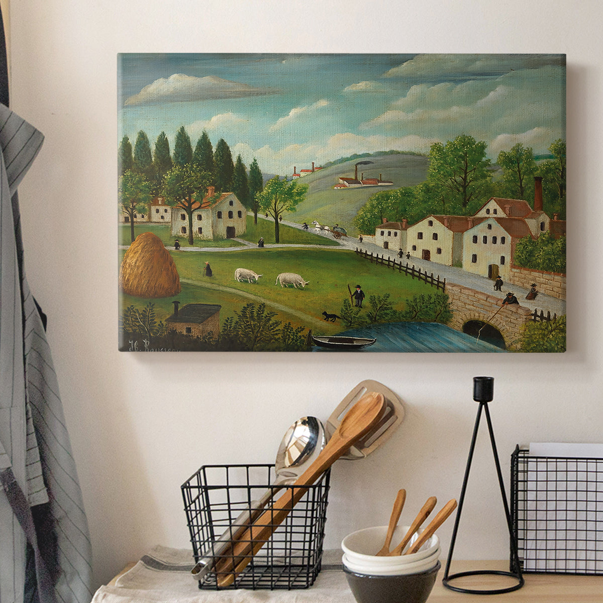 Canvas art print detailing a peaceful landscape combining human activity and nature, displayed in a softly lit workspace setting