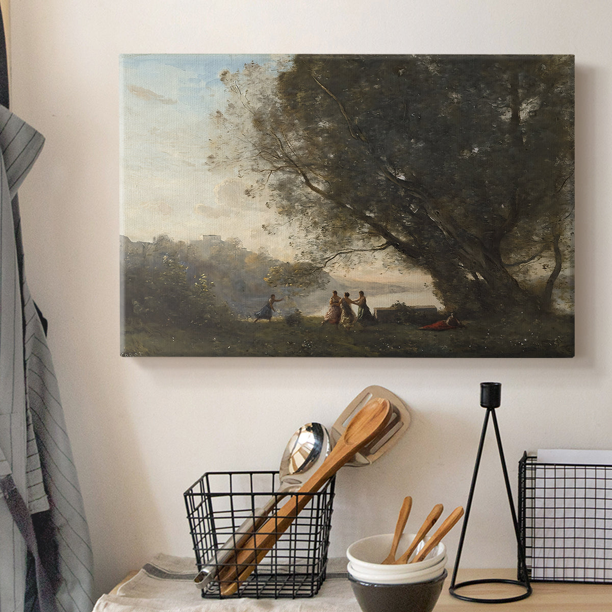 Canvas art print detailing a tranquil outdoor composition with dancing figures and lake, displayed in a softly lit workspace setting