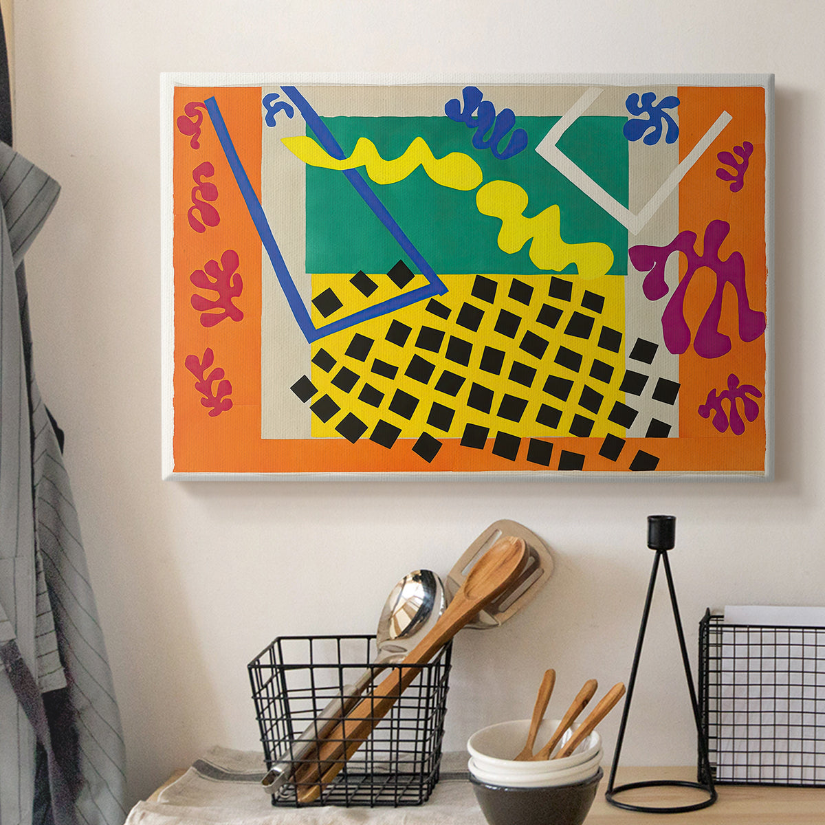 Canvas art print detailing a stylized cut-out design with flowing organic shapes, displayed in a softly lit workspace setting
