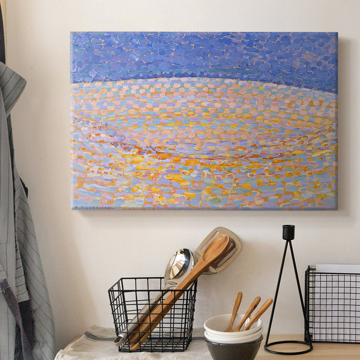 Canvas art print detailing a simplified landscape using texture and color variation, displayed in a softly lit workspace setting