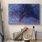 Canvas art print detailing an early modern depiction of tree using bold contrast, displayed in a softly lit workspace setting