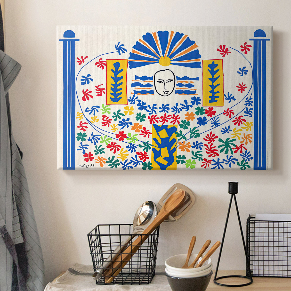 Canvas art print detailing a decorative artwork with geometric motifs and vibrant colors, displayed in a softly lit workspace setting