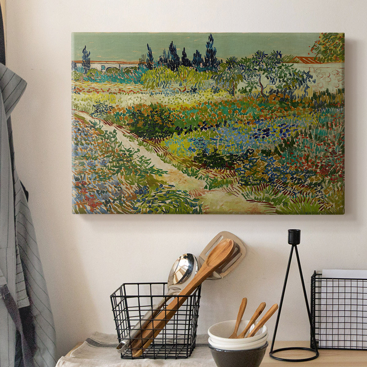 Canvas art print detailing a stylized landscape featuring plants and pathways, displayed in a softly lit workspace setting