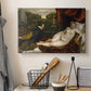 Canvas art print detailing a classical interior with reclining Venus and seated organist, displayed in a softly lit workspace setting