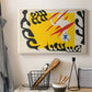Canvas art print detailing a stylized cut-out design featuring animal imagery, displayed in a softly lit workspace setting