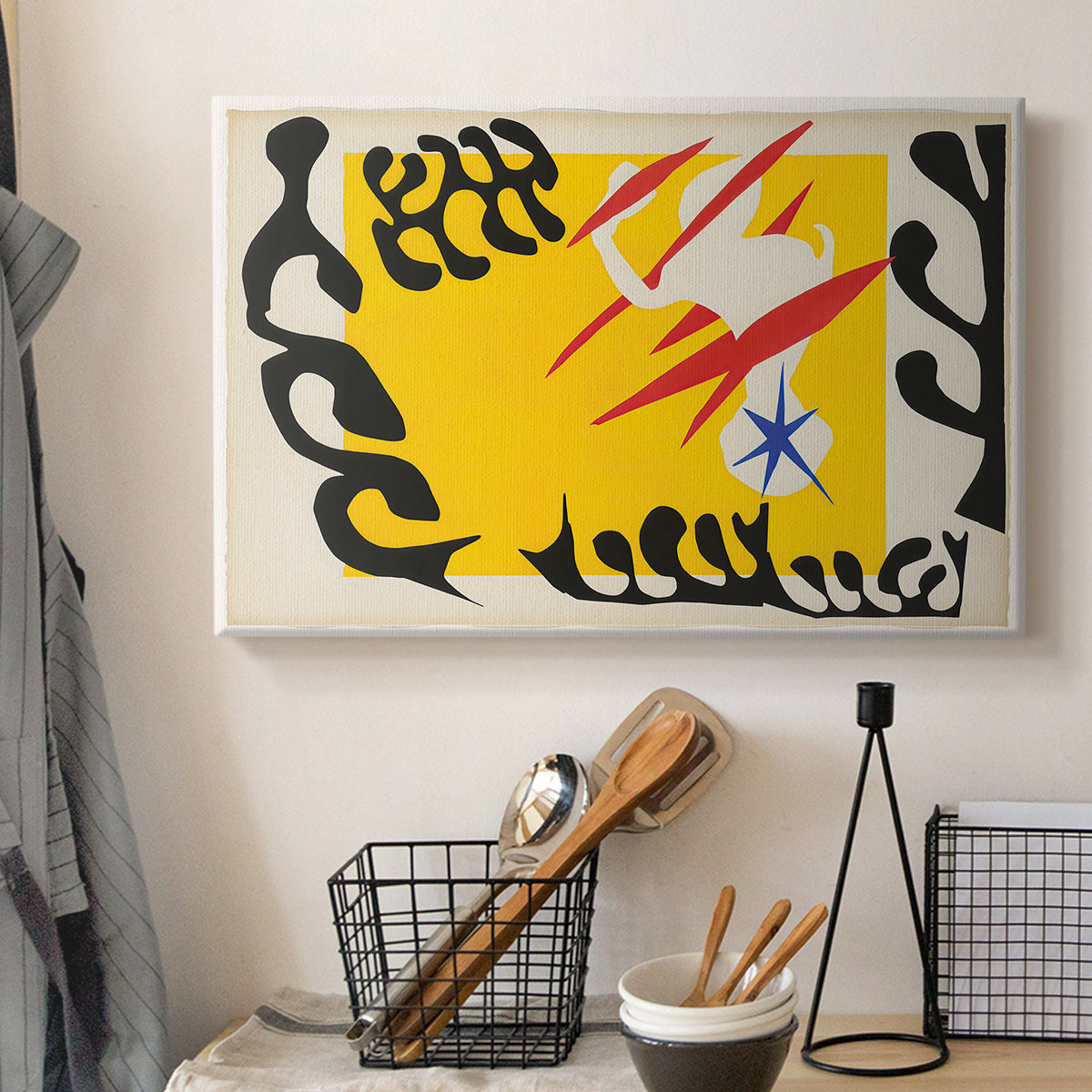 Canvas art print detailing a stylized cut-out design featuring animal imagery, displayed in a softly lit workspace setting